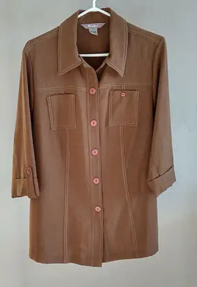 A large lot of mature or senior ladies' clothing, most in sizes 10-16 or M-L. Items include tops, sw...