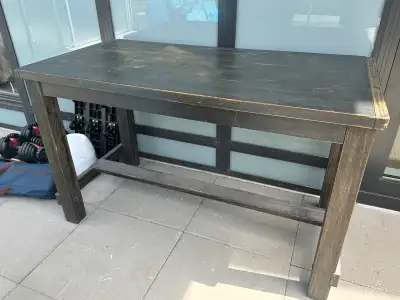 Good solid table, could be used on a deck as a eating area or bar to sit around or as a very solid w...