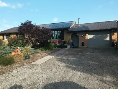 Country property landscaped with trees and shrubs around entire property for privacy. Main floor lau...