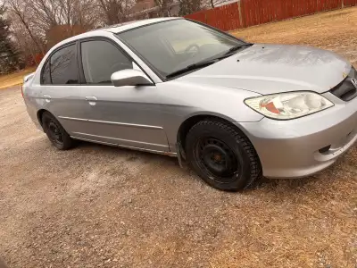 2005 honda civic very fuel efficient car interior is pretty clean exterior has little bit of rust an...