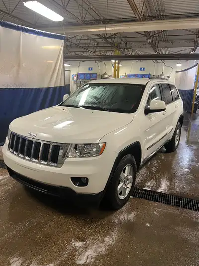 I'm selling my 2011 Jeep Grand Cherokee Laredo, a reliable SUV with 206,000 kilometers on it. This S...