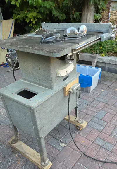Delta Tilting Arbor Saw - a substantial table saw on casters for easy movement. Includes original us...