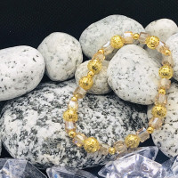 Handmade beaded stretch bracelets with gold accents 