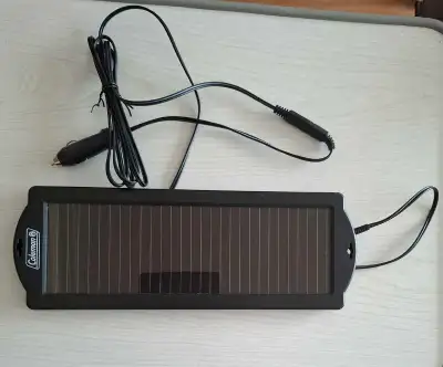 Keep your car battery charged with this Coleman 12V Solar Trickle Battery Charger. This is a used un...
