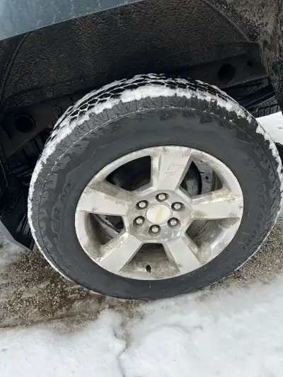 Set of 4 275/60R20 Bridgestone Dueler A/T tires on 20 inch Silverado rims with no sensors. 9/32 trea...