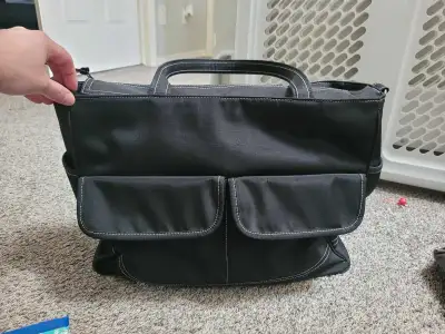 Nice diaper bag, has shoulder strap, comes with change pad and extra wipes pouch. Many pockets, in g...