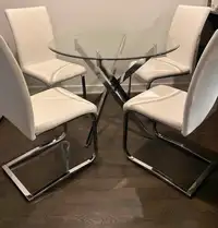 The Brick 5 Piece Glass dining set with 4 chairs included