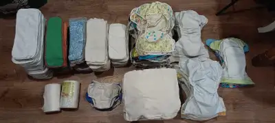 Huge lot of good used condition cloth diaper supplies, including - 2 rolls of diaper liners - 3 swim...