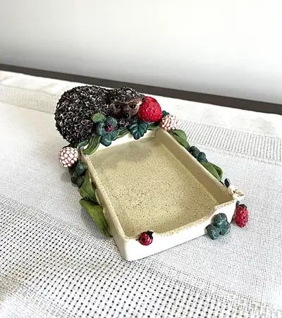 Crafted with a whimsical flair, the Hedgehog Paper/Pen Holder is a delightful addition to any deskto...