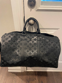 Louis Vuitton Keepal 59 duffel bag.