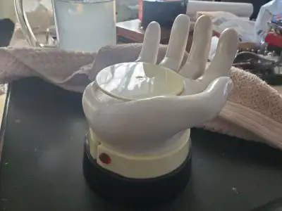 Sert-cocktail drink server. A helping hand. Novelty gift. Activated by weight of glass. In original...