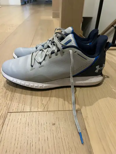 Small tear in right shoe near insole.