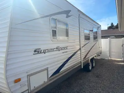 2009 holiday trailer in very good condition. Has walk around queen bed and bunk beds. Large power sl...