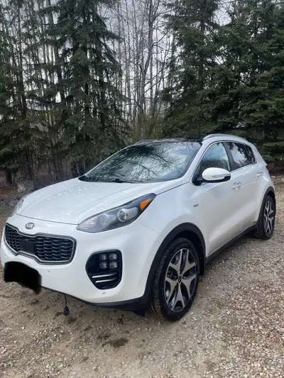 Selling my 2017 Kia Sportage SX Turbo AWD in stunning Snow White Pearl with black leather interior....
