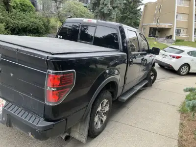 Check out this black Ford F-150 pickup truck, ready to tackle any job or adventure! While it's showi...