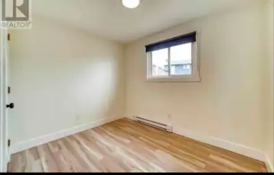 This private room is available for rent and features hardwood flooring, a window for natural light,...