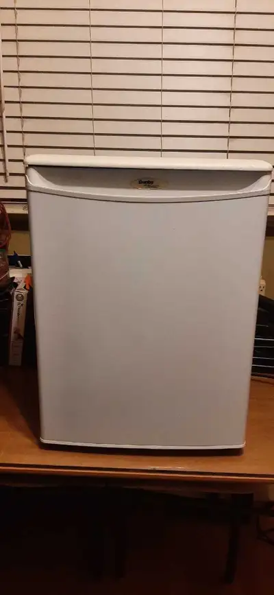 Selling a Compact white Danby mini fridge. It has multiple shelves for storage. 18.5 X 18 X 25. It's...