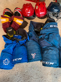 Hockey gear pants helmets gloves, skates , sticks