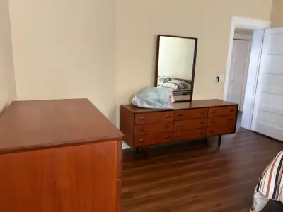 I am selling a Mid-Century Modern dresser with a mirror, a timeless piece that brings a touch of vin...