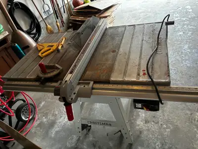 Craftsman table saw with blade. Well used. It lots of life left.