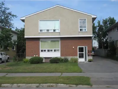 Large 2 bedroom and den, faces west, oak kitchen, oak floors, 4 appliances, quiet yard, mature trees...