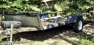 This trailer could be used to carry ATV OR BOAT Riding lawn trailer 58 inch wide and 14 feet long Ne...