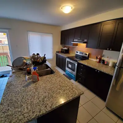 Room available for a girl in sharing for rent in a 4 bedroom townhouse in Doon South, Kitchener. Clo...