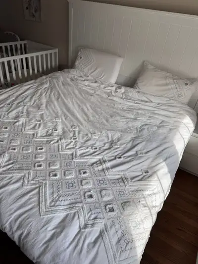 Elevate your bedroom with this stylish Brunelli queen-size duvet cover set, complete with two matchi...