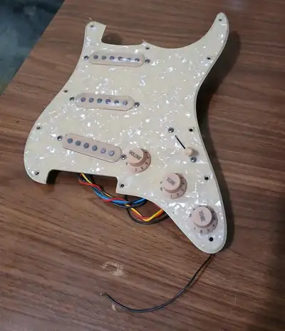 These are brand new, never put in a guitar. The first photo is of vitnage white pearl. If you're aft...