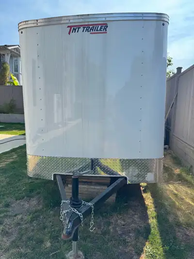 I'm selling a 6x10 ft enclosed cargo trailer, perfect for hauling your goods safely and securely. Th...