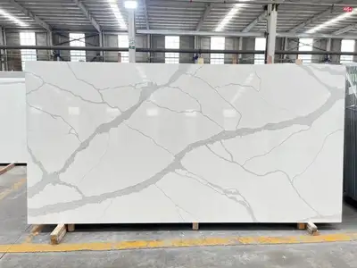 This brand new premium Calacatta quartz slab features a stunning white base with elegant, bold grey...