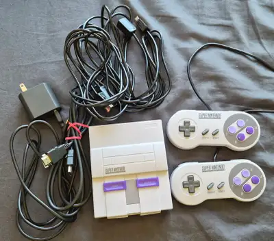 No longer use Comes with console, 2 controllers, controller extenders, hdmi & adaptor Dont have the...