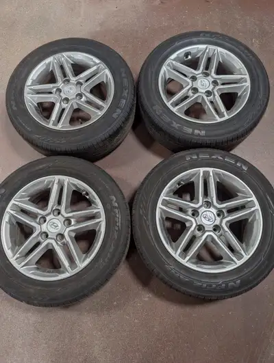 Four 205/60R16 Nexen all season tires on Hyundai alloy wheels, all in excellent condition, the bolt...
