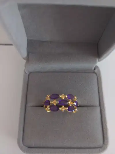 New elegant gold-rhodium plated sterling silver ring featuring vibrant marquise-cut natural amethyst...