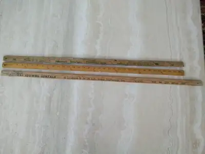Three Wooden Yardsticks, one advertising Muttart Builders' Supplies (Peterborough) Limited, Highway...
