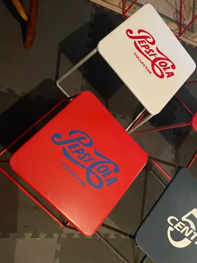New metal patio tables with various decals on top, stackable, 12.5” square, 14.5” high. $25 each 1 U...