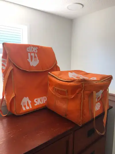 two skip the dishes bags in very good condition, one flat and the second square shape