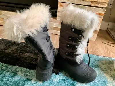 Arctic Tracks winter boots, size 2 youth. My daughter wore at age 8. Heavy duty, waterproof, and war...