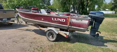 16’ Lund Pike. 50hp , trolling motor. Has live well, pedestal seating, Bimini top. Newer tires on tr...