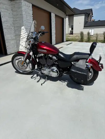 I am selling a used 2009 Harley Davidson 1200L, a stylish cruiser known for its smooth ride and clas...