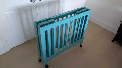 Babyletto Origami Foldable Mini Crib. Turquoise colour, all parts, hardware and manuals included. Re...