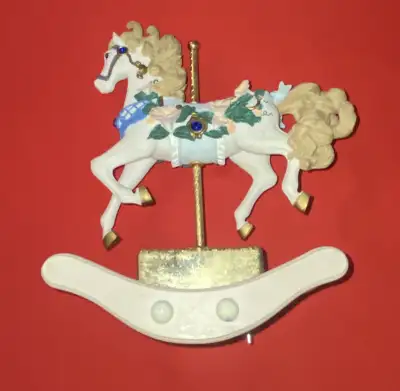 Selling a carrousel music box that plays the sound of music song rocks back-and-forth while playing...