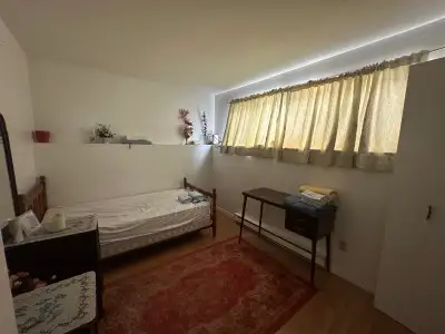 Furnished private room + bathroom in basement of a townhouse. You will be sharing kitchen, living an...