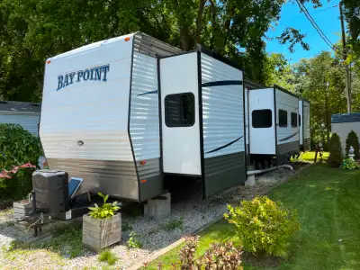 The park model trailer has two king bedroom, large living area and one and a half bathrooms