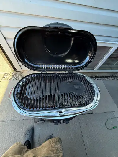 Get ready to grill on the go with this Coleman Roadtrip grill! This portable propane grill is in use...