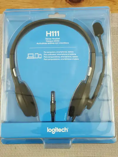 Looking to sell a Logitech H111 stereo headset with a microphone that delivers clear sound for music...