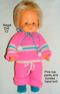 13" Regal doll, soft,wets, head rotates,  knit clothes