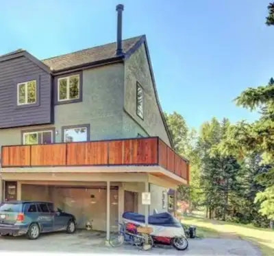 2 bed 1.5 bath downtown PET friendly townhouse with wrap around deck, wood burning fireplace, covere...