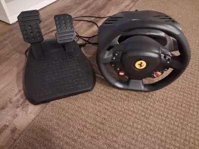 Thrustmaster t80 ferrari racing wheel.  PS5/PS4, View more