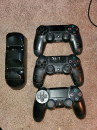 3 ps4 remotes and charging dock 